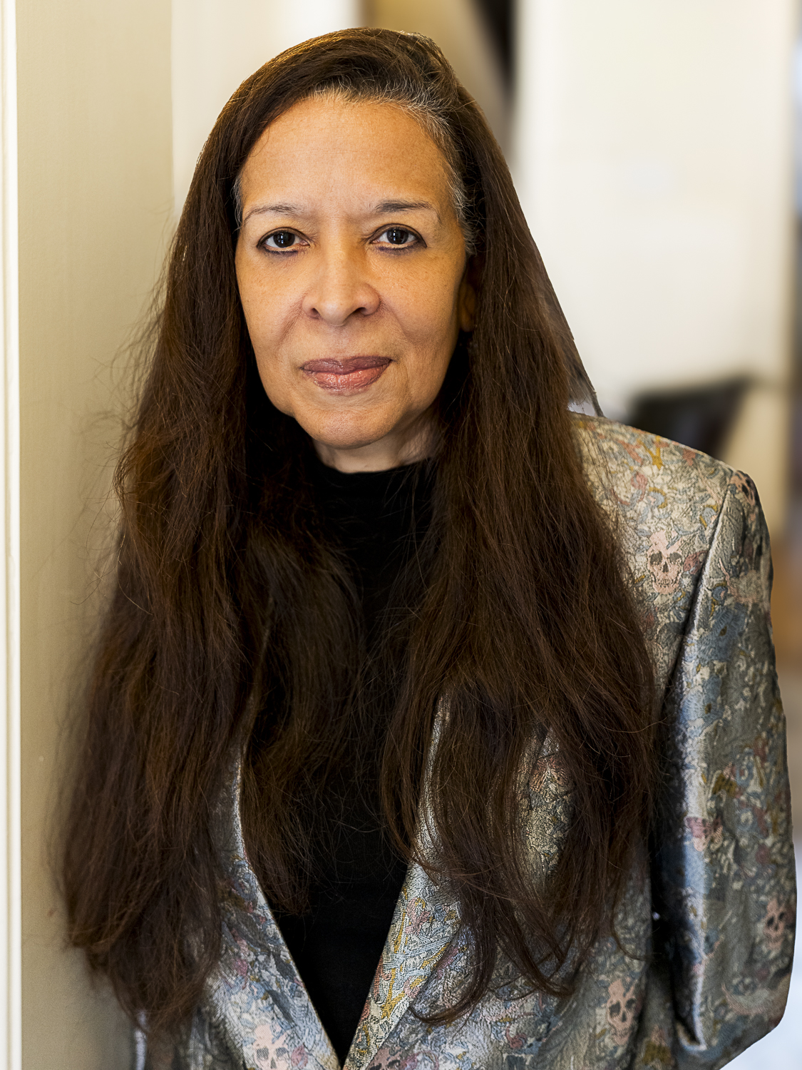 Portrait of Dr. Pamela Brown in a brocade jacket