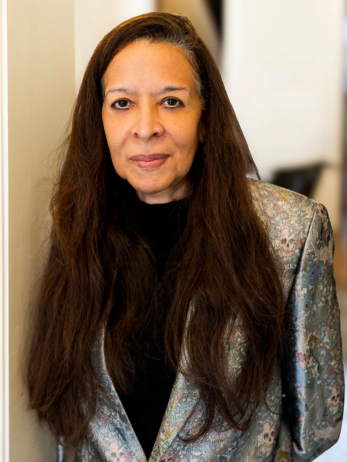 Portrait of Dr. Pamela Brown in a brocade jacket